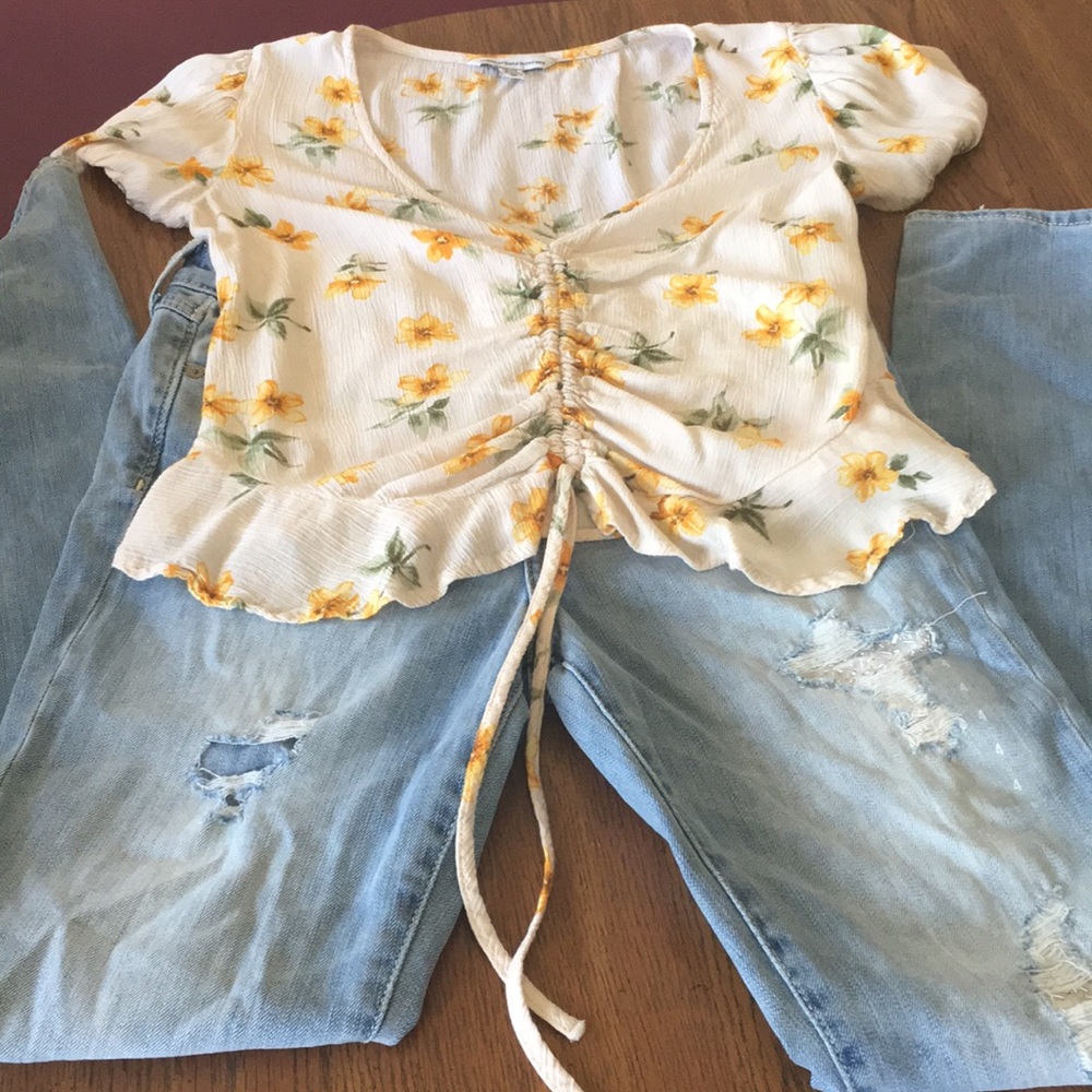 High rise jeans with beading in distressed areas.